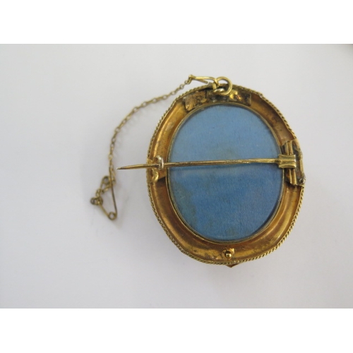 142 - A gold plated octagonal bangle - 8cm wide external - and a gilt metal mourning brooch