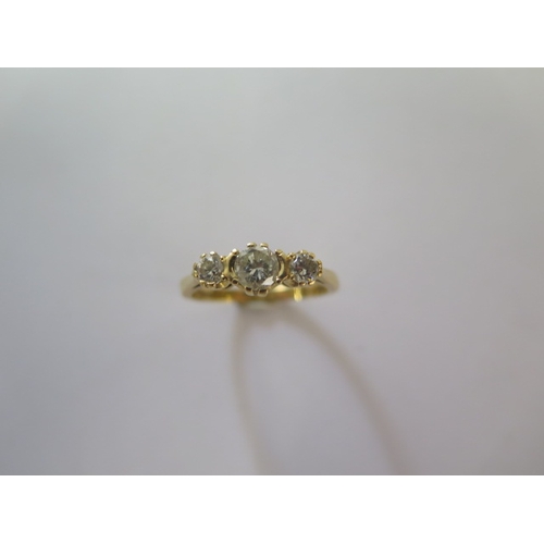 143 - An 18ct yellow gold three stone diamond ring size Q - approx weight 3.7 grams - good condition, diam... 