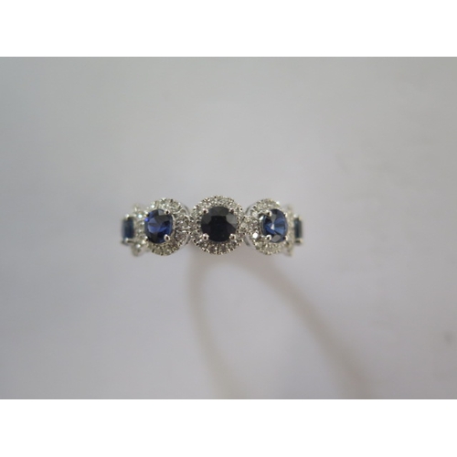 144 - A platinum 5 stone sapphire and diamond ring, the sapphires are well matched and of a good colour, d... 