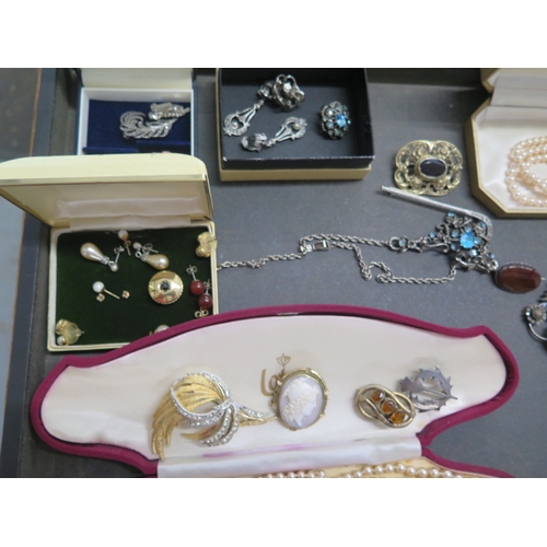 149 - A collection of assorted costume jewellery and watches including a silver bangle