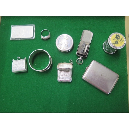 153 - A silver napkin ring, a one ounce silver ingot, a 925 ring and stamp case and coin case and four bas... 