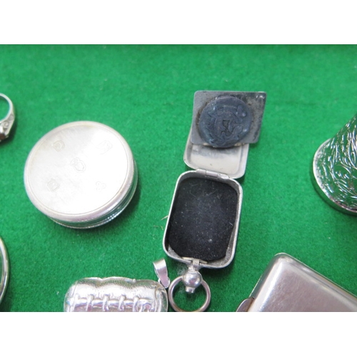 153 - A silver napkin ring, a one ounce silver ingot, a 925 ring and stamp case and coin case and four bas... 