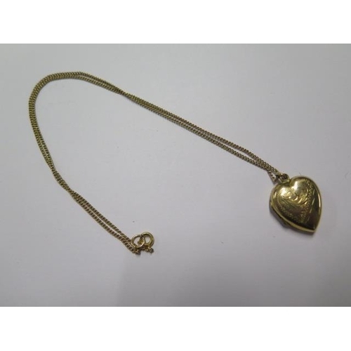 18 - A 9ct yellow gold chain - Length 40cm - with a 9ct plated back and front heart locket - total weight... 