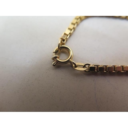 19 - A 14ct yellow gold 585, 78cm box link chain approx weight 31.9 grams - in good condition