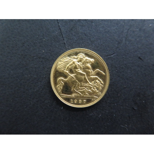 232 - A George VI gold half sovereign dated 1937 - the plain edge indicates this is a commemorative coin n... 