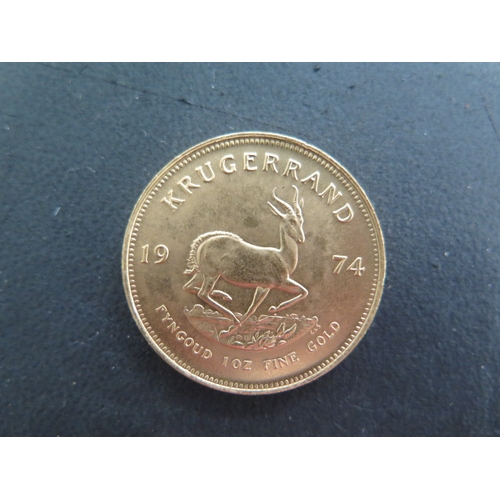 255 - A Fyngoud 1oz Fine Gold Krugerrand coin dated 1974