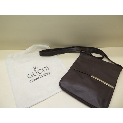 263 - A Gucci brown leather handbag 27cm x 23cm - with sleeve - some wear but no damage