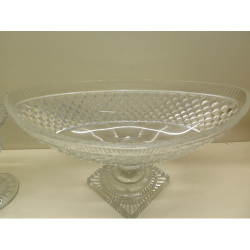 281 - A cut glass Navette shaped bowl on stand - Height 25cm x 43cm - some scratches and small chips mainl... 