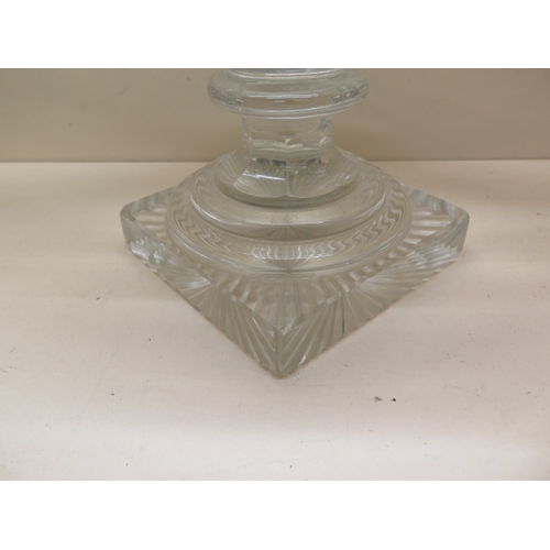 281 - A cut glass Navette shaped bowl on stand - Height 25cm x 43cm - some scratches and small chips mainl... 