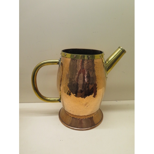 282 - An Arts and Crafts style copper and brass jug - Height 30cm - generally good, some denting