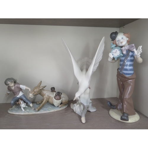 284 - Three Lladro groups - A Clown, boxed and a Bird, boxed - including Ahoy There, boxed and two other g... 