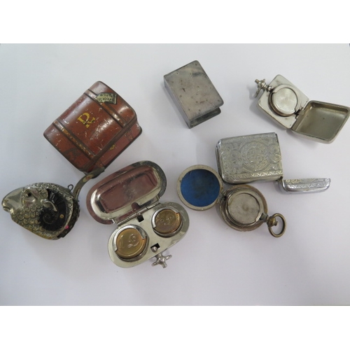 299 - Three base metal coin cases, a plated vesta, a Rams head vesta and a plated matchbox case and miniat... 