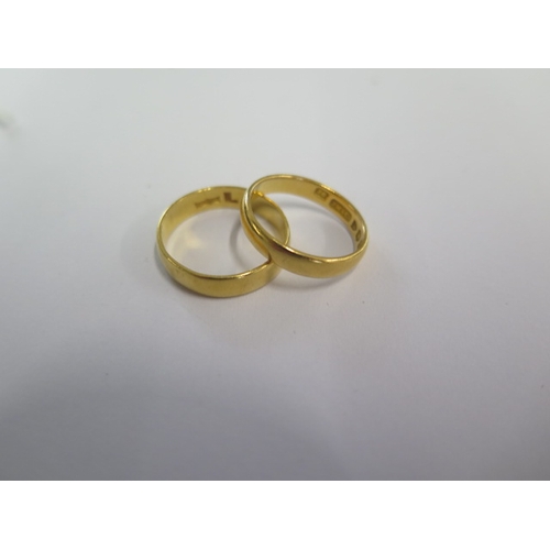 3 - Two 22ct hallmarked yellow gold band rings sizes M and J - total weight approx 6.5 grams - both gene... 