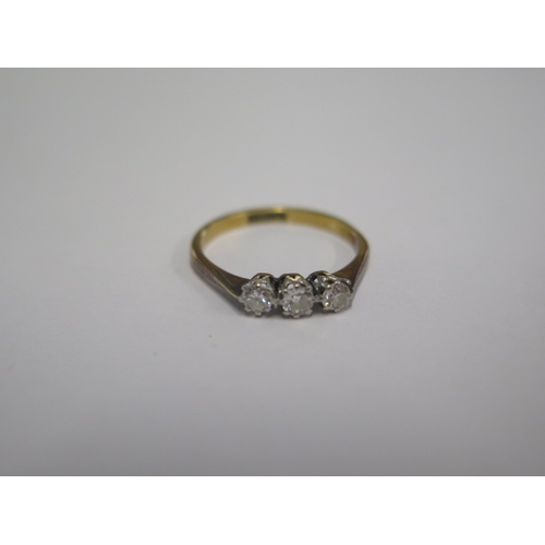 32 - An 18ct yellow gold three stone diamond ring size L - approx weight 1.7 grams - diamonds bright