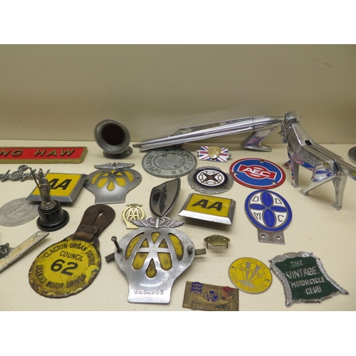 369 - A collection of 26 motoring/car badges, a Rocket mascot and an Ariel Centenary nut cracker