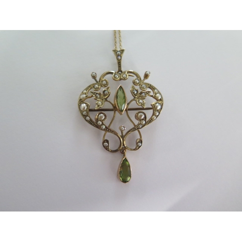 37 - A 9ct yellow gold pearl and peridot pendant - Height 5cm - on a 9ct fine chain - total weight approx... 
