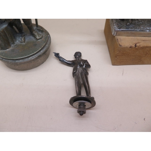 377 - Three figural car mascots - Dart player, Jockey and horse and Blacksmith - Height 14cm