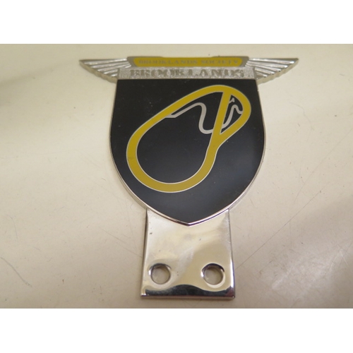 379 - A Brooklands Automobile Racing Club enamel car badge on stand by Spencer London number 868 - some ch... 