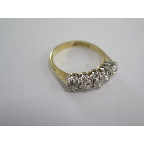 40 - An 18ct yellow gold and platinum five stone diamond ring - the central diamond approx 0.24ct - ring ... 