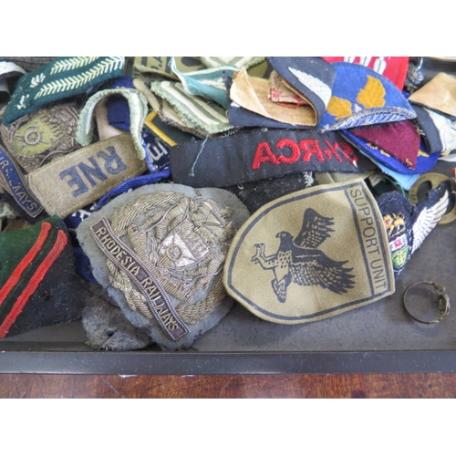 404 - A collection of assorted Military badges, belts and buckles