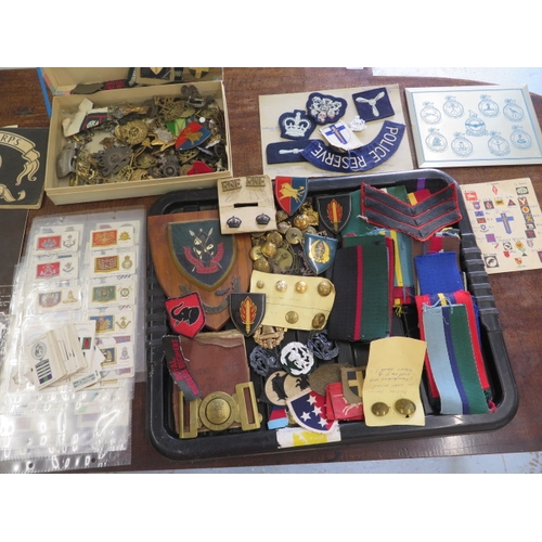 407 - A collection of assorted Militaria including badges, buttons, cigarette cards etc