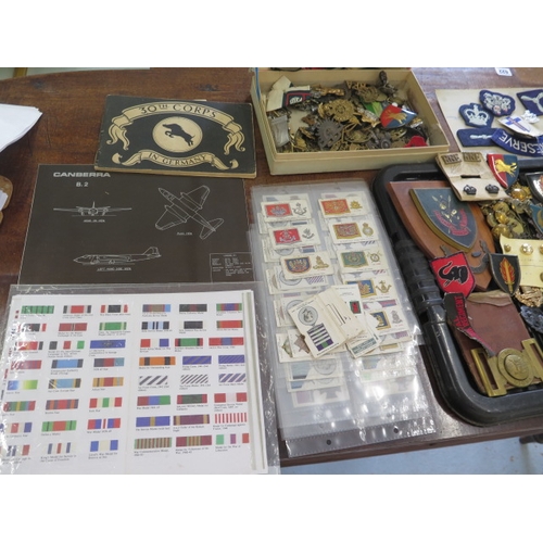 407 - A collection of assorted Militaria including badges, buttons, cigarette cards etc