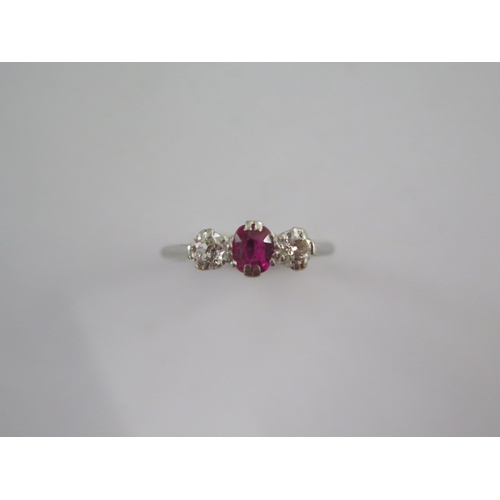 45 - A platinum diamond and ruby type three stone ring size M - approx weight 2.7 grams - stones bright