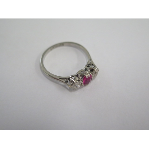 45 - A platinum diamond and ruby type three stone ring size M - approx weight 2.7 grams - stones bright