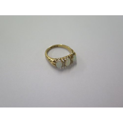 47 - An 18ct yellow gold three stone opal ring set with small diamonds - ring size N - approx weight 4.2 ... 