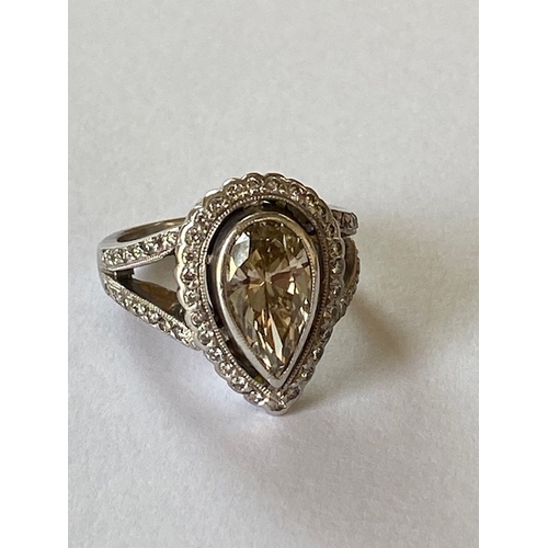 55 - An impressive pear cut 18ct white gold diamond ring - the natural pear cut diamond measures approx 1... 