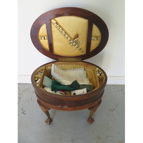 554 - An oval mahogany inlaid workbox with contents - Height 49cm x 60cm x 44cm