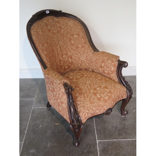 567 - A Victorian style armchair recently reupholstered - in good condition