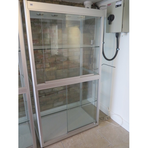 576 - A large good quality shop display cabinet with sliding doors - Height 183cm x Width 120cm x Depth 60... 