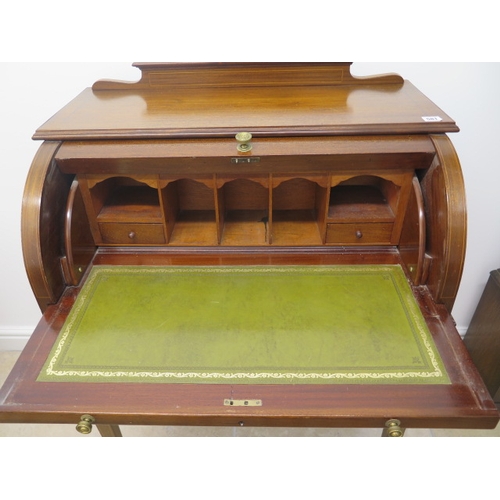 581 - An Edwardian inlaid mahogany cylinder top writing desk with a fitted interior over two frieze drawer... 