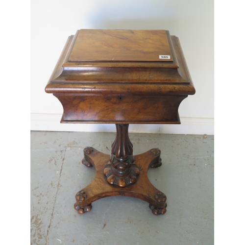 585 - An early Victorian walnut teapoy on a shaped column and quatrefoil platform base with relined interi... 