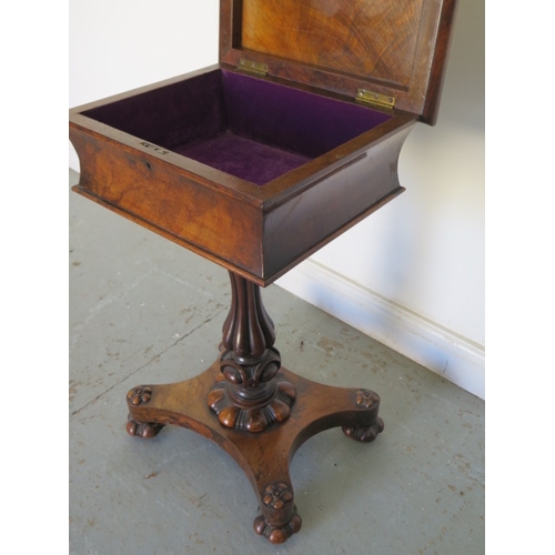 585 - An early Victorian walnut teapoy on a shaped column and quatrefoil platform base with relined interi... 