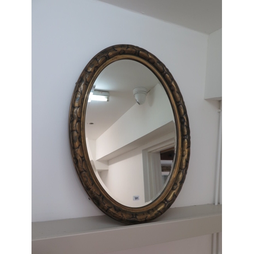 591 - An oval gilt mirror - 89cm x 63cm