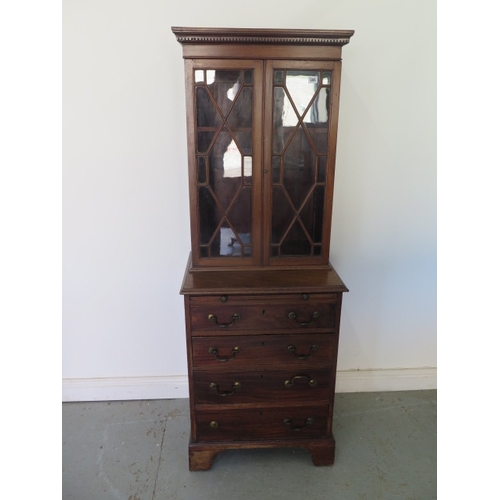 595 - A mahogany bookcase chest with a two door astragal glazed top over a four drawer chest with a brushi... 