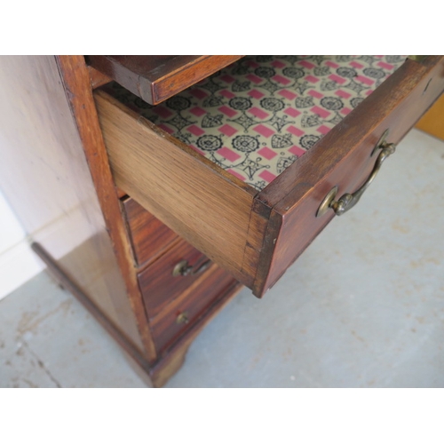 595 - A mahogany bookcase chest with a two door astragal glazed top over a four drawer chest with a brushi... 