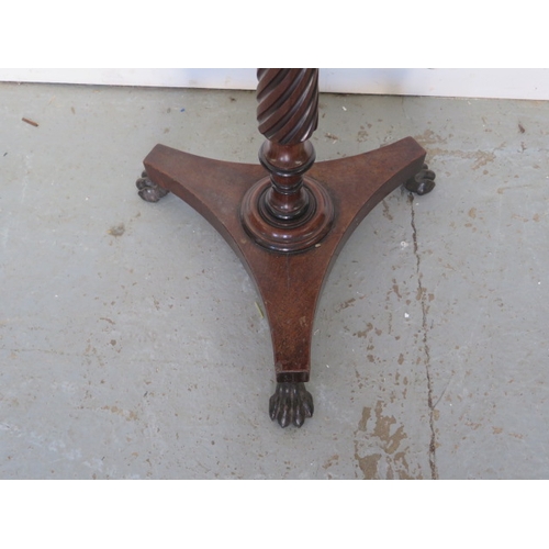 597 - A mahogany wine table on a turned fluted column, platform base and cast iron claw feet - Height 73cm... 