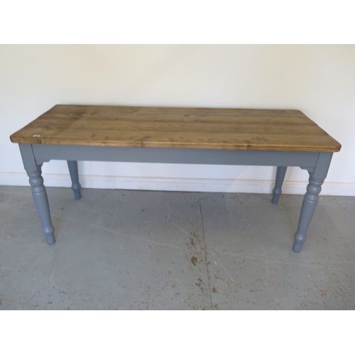 600 - A pine kitchen table with a painted base and thick four plank top - Height 77cm x 178cm x 70cm