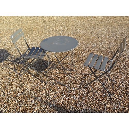 634 - A grey metal folding patio/bistro table and two chairs