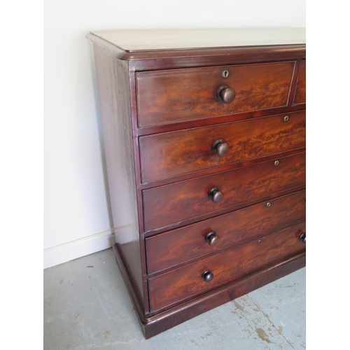 636 - An early Victorian flame mahogany chest of two over four graduated drawers on a plinth base - Height... 