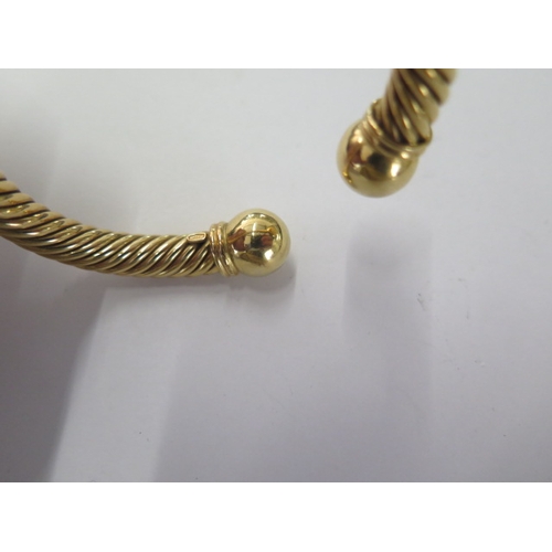 65 - An 18ct 750 yellow gold rope twist torque bangle - approx weight 46 grams - in good condition