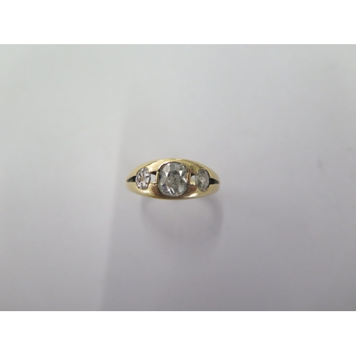 67 - An 18ct yellow gold three stone diamond ring size O - the central diamond approx 6mm x 5mm x 3.5mm 0... 