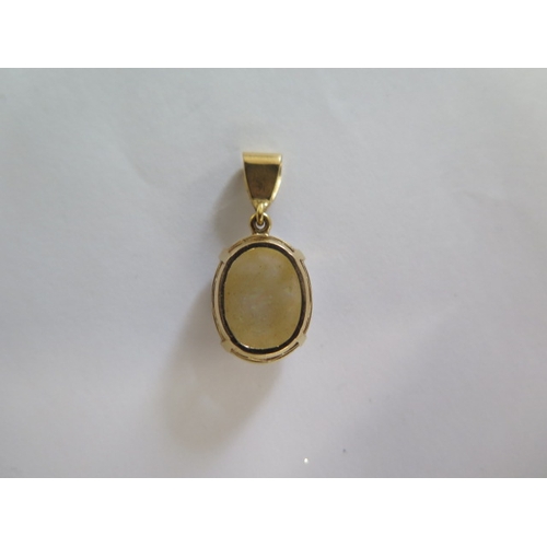 68 - A yellow metal opal pendant - Opal approx 15mm x 12mm - in good condition - approx weight 2.5 grams