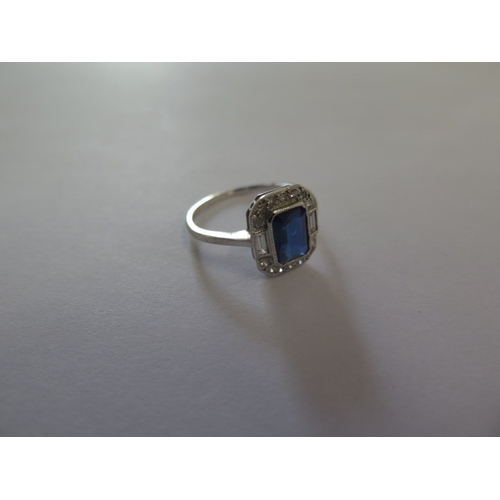 73 - A white metal (possibly platinum) sapphire and diamond ring size J/K - head approx 10mm x 9mm - in g... 