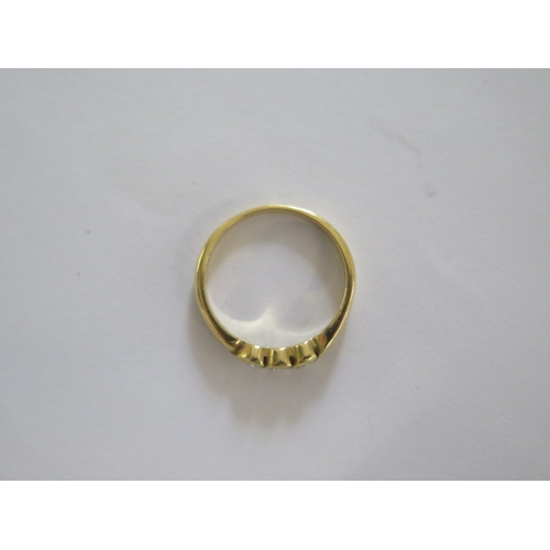 75 - An 18ct yellow gold three stone diamond ring size M - approx weight 3.2 grams - in good condition