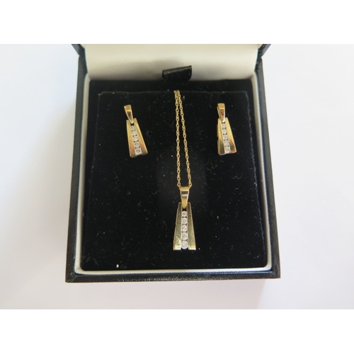 81 - A pair of 9ct yellow gold diamond earrings and matching pendant on a 46cm chain - good condition - t... 