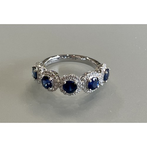 144 - A platinum 5 stone sapphire and diamond ring, the sapphires are well matched and of a good colour, d... 